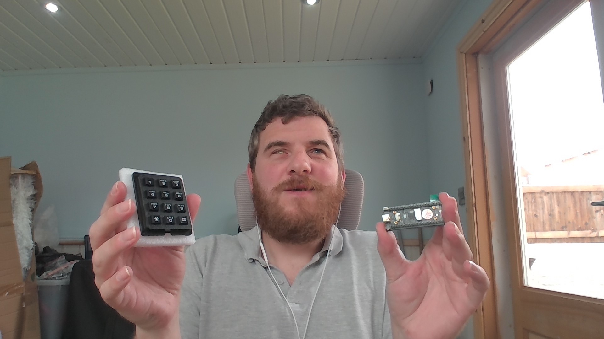Me at my desk, headphones in, unshaven but triumphant with the first bit of hardware in-hand.