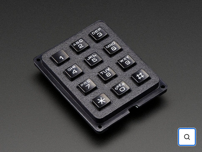 The front face of the keypad, with its 4 screw holes visible at the corners
